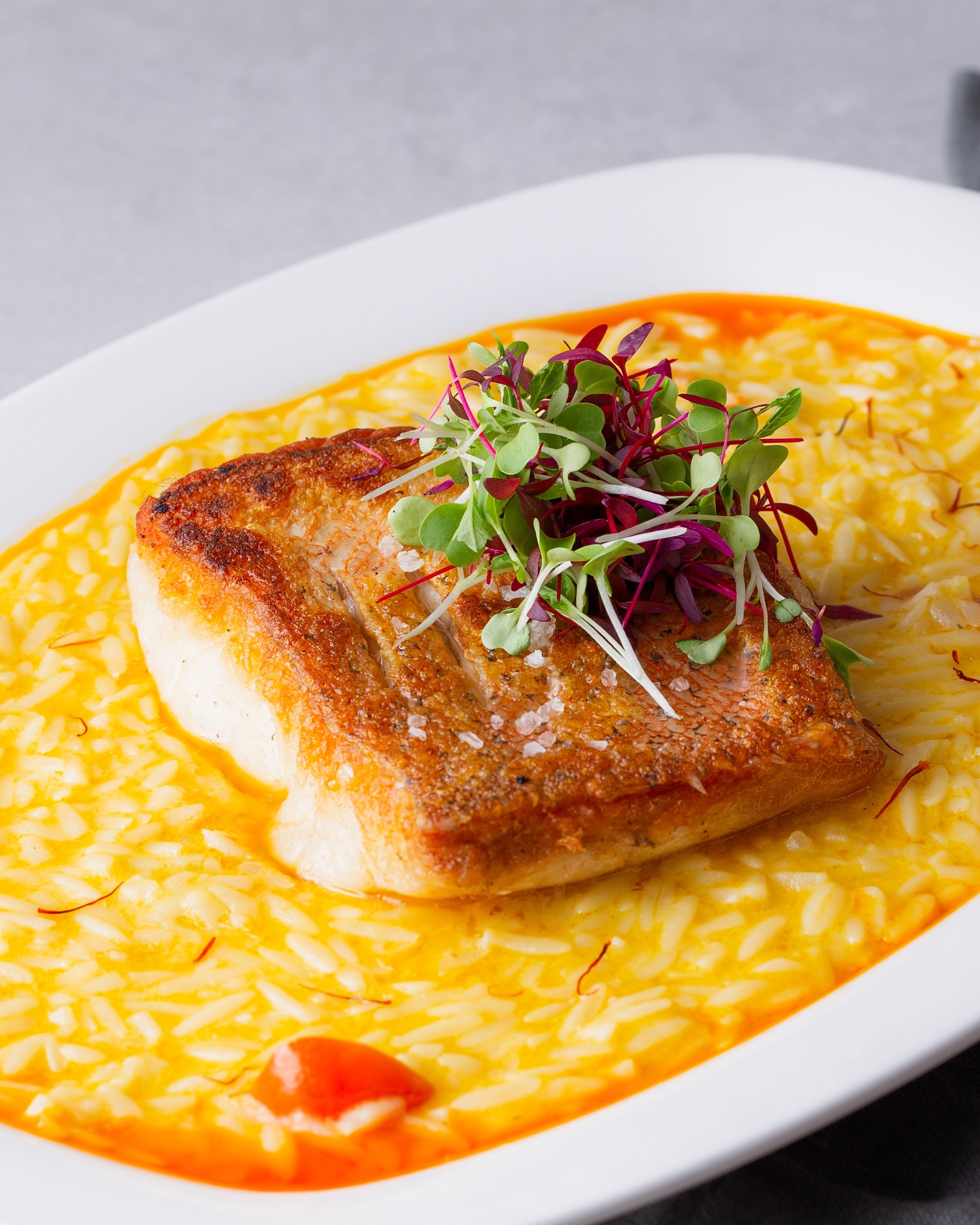 Saffron risotto with pan-seared fish